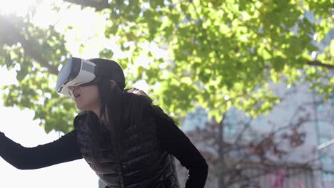 Young-woman-in-VR-headset-in-park